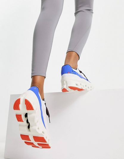 On Running Cloudmonster trainers in white and cobalt