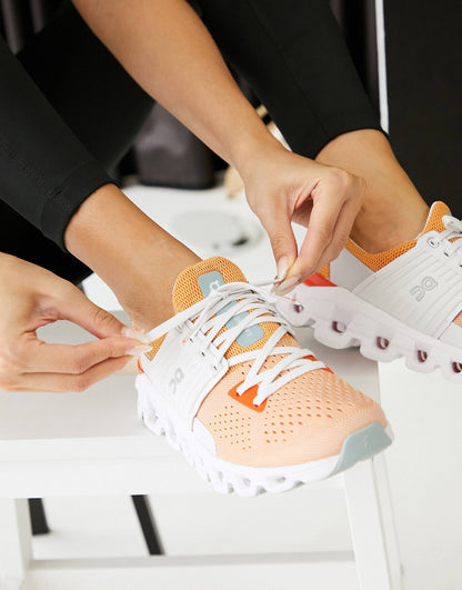 On Running Cloudswift trainers in orange and white